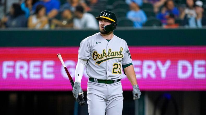 The Athletics' Shea Langeliers, a former Braves prospect, walks back to the dugout after striking out during the seventh inning Tuesday night against the Rangers in Arlington, Texas. (AP Photo/Tony Gutierrez)