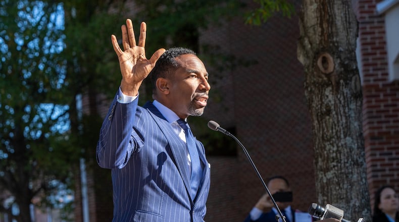 At a ceremony unveiling a new MARTA bus featuring Andrew Young, Mayor Andres Dickens, left, honors Andrew Young at the Ray Charles Performing Arts Center at Morehouse College on Friday, November 15, 2024.  (Jenni Girtman for The Atlanta Journal-Constitution)