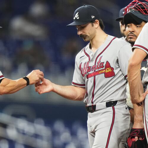 Atlanta Braves starting pitcher Spencer Strider, right, hands the ball to manager Walt Weiss (22) as he is relieved during the seventh inning of a baseball game against the Miami Marlins, Thursday, May 21, 2026, in Miami. (AP Photo/Lynne Sladky)
