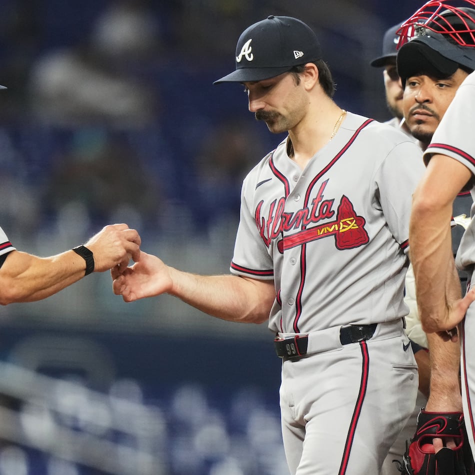 Atlanta Braves starting pitcher Spencer Strider, right, hands the ball to manager Walt Weiss (22) as he is relieved during the seventh inning of a baseball game against the Miami Marlins, Thursday, May 21, 2026, in Miami. (AP Photo/Lynne Sladky)