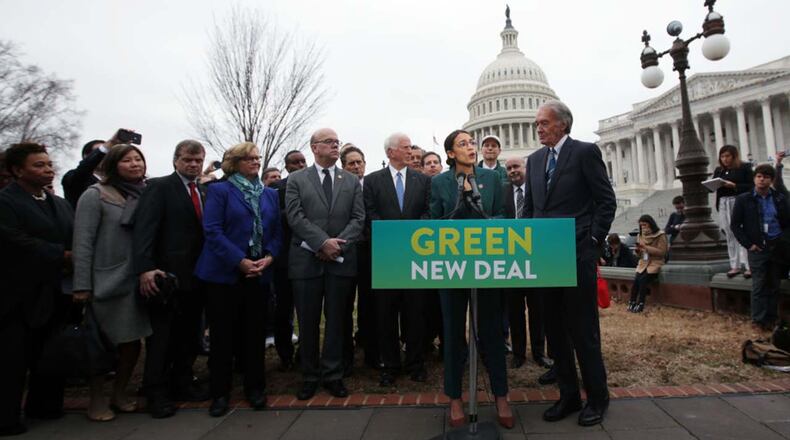 U.S. Rep. Alexandria Ocasio-Cortez (D-NY) speaks as Sen. Ed Markey (D-MA) (R) and other Congressional Democrats listen during a news conference in front of the U.S. Capitol February 7, 2019 in Washington, DC. Sen. Markey and Rep. Ocasio-Cortez unveiled their Green New Deal resolution.
