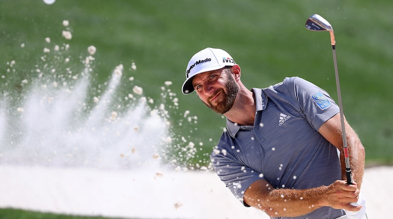 Just in case he needs it this week, Dustin Johnson works on his bunker game during a Masters practice round Tuesday. (Curtis Compton/ccompton@ajc.com)