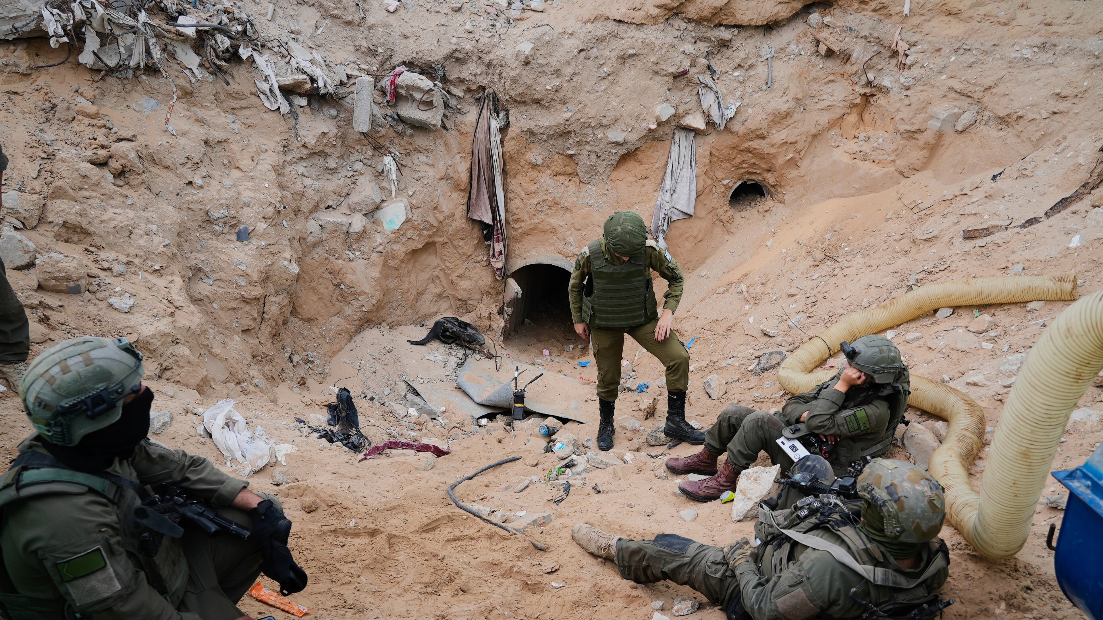 Israeli soldiers stand at the entrance of a tunnel where the army says the body of soldier Hadar Goldin was held in Rafah, Gaza Strip, Monday, Dec. 8, 2025. Hamas returned his remains to Israel as part of the current ceasefire. (AP Photo/Sam Mednick)