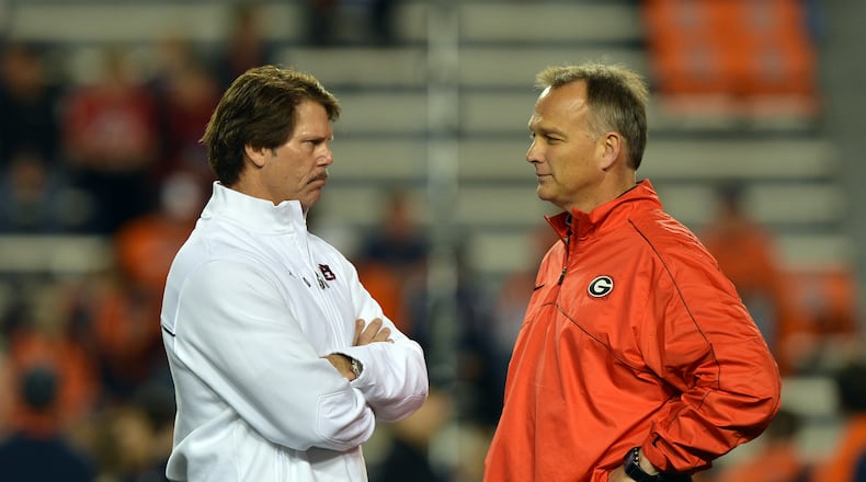 November 10, 2012. Georgia head coach Mark Richt, right, talks to his former defensive coordinator Brian VanGorder, now defensive coordinator with Auburn, during pre-game at Jordan-Hare Stadium in Auburn Saturday November 10, 2012. BRANT SANDERLIN / BSANDERLIN@AJC.COM