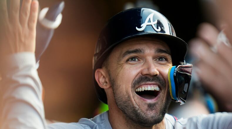 Atlanta Braves' Adam Duvall celebrates after hitting a home run during the third inning of a baseball game against the Chicago Cubs, Wednesday, May 22, 2024, in Chicago. (AP Photo/Erin Hooley)