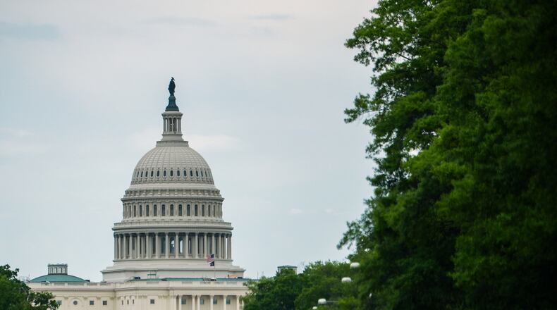 The U.S. Capitol is seen from Pennsylvania Avenue, Wednesday, May 13, 2026, in Washington. (AP Photo/Julia Demaree Nikhinson)