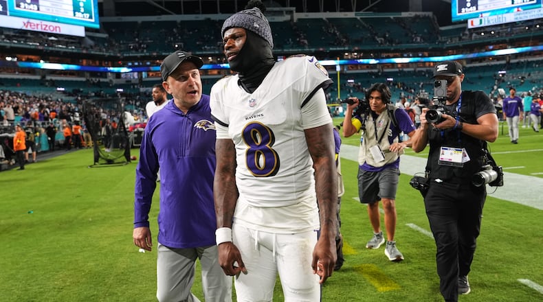Baltimore Ravens quarterback Lamar Jackson (8) leaves the field after a win over the Miami Dolphins in an NFL football game, Thursday, Oct. 30, 2025, in Miami Gardens, Fla. (AP Photo/Lynne Sladky)