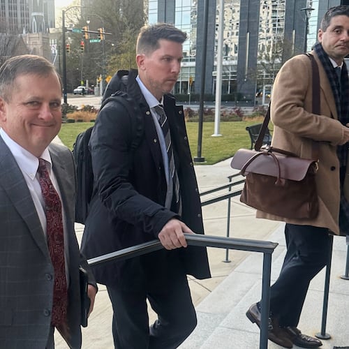 FILE - Front Row Motorsports owner Bob Jenkins, left, and 23XI co-owner Denny Hamlin arrive in the Western District of North Carolina on Monday Dec 1, 2025 in Charlotte, N.C. (AP Photo/Jenna Fryer, File)