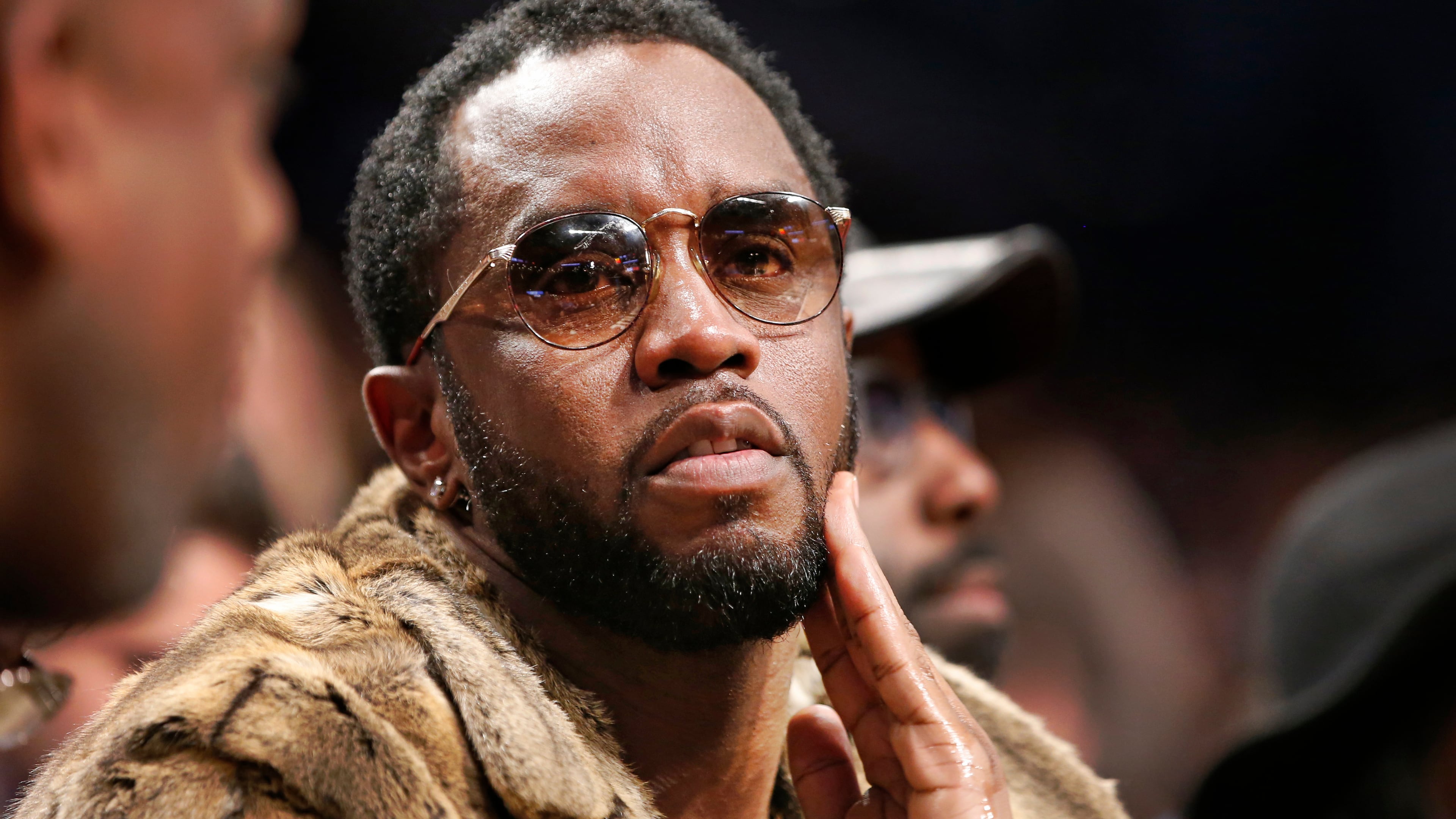 FILE - Sean "Diddy" Combs sits courtside in the second half of an NBA basketball game between the Brooklyn Nets and the New York Knicks, March 12, 2017, in New York. (AP Photo/Kathy Willens, File)
