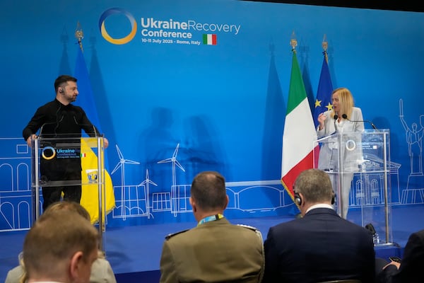 Ukraine's President Volodymyr Zelenskyy and Italian Prime Minister Giorgia Meloni speak with media reporters during the Ukraine Recovery Conference at La Nuvola convention center in Rome, Thursday, July 10, 2025. (AP Photo/Gregorio Borgia)