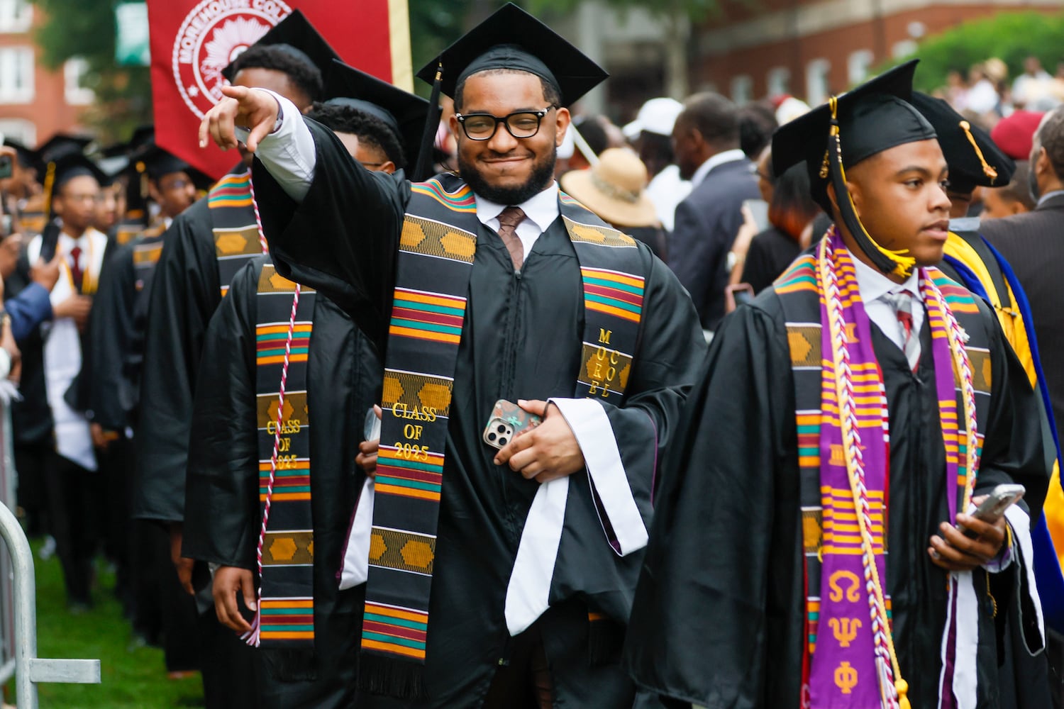 A graduate reacts to family members as he enters the ceremony during Morehouse College's 141st Commencement Ceremony on Sunday, May 18, 2025.
(Miguel Martinez/ AJC)