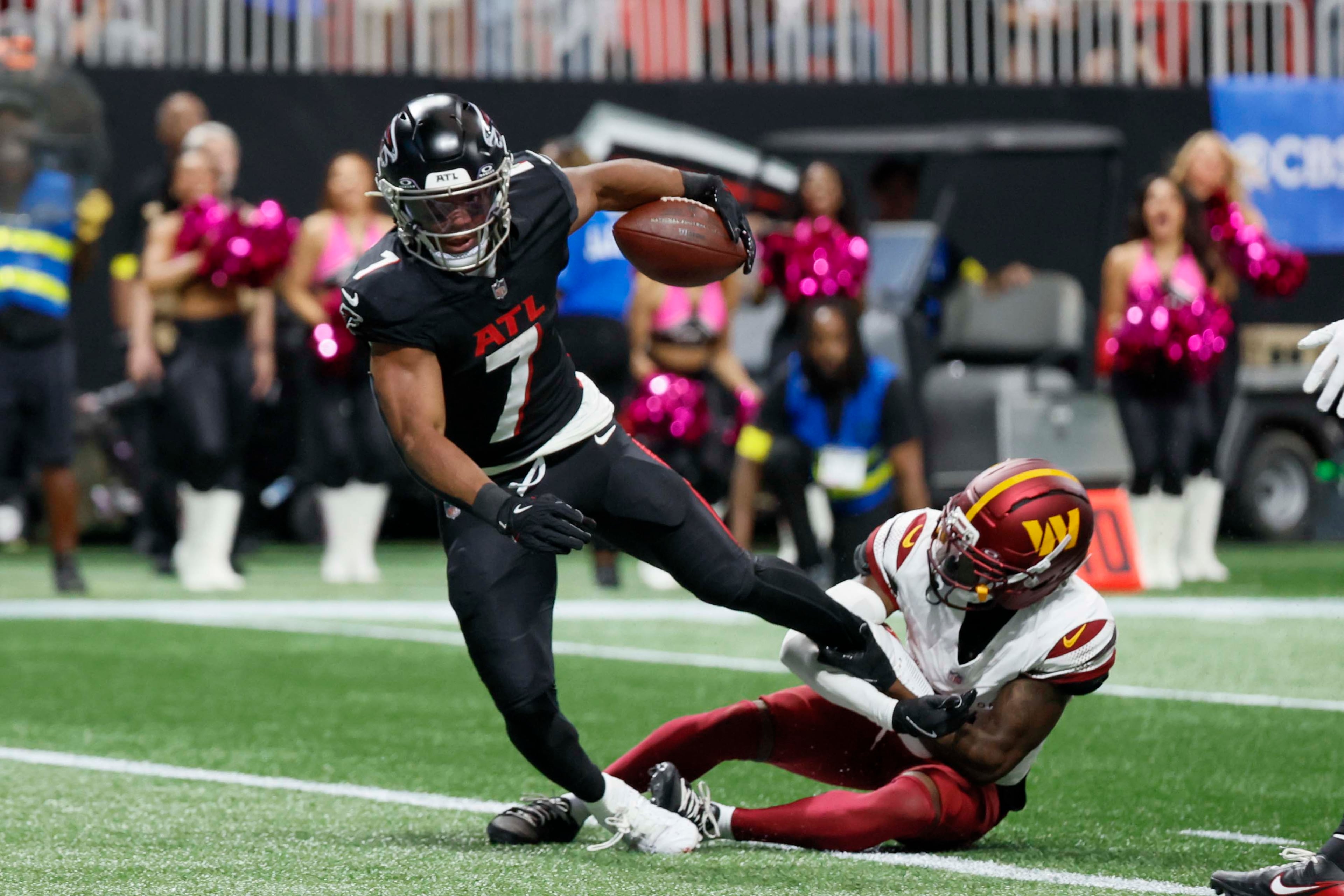Atlanta Falcons running back Bijan Robinson crosses the goal line for a touchdown during the first half of an NFL game against the Washington Commanders at Mercedes-Benz Stadium in Atlanta on Sunday, September 28, 2025. (Miguel Martinez/AJC)