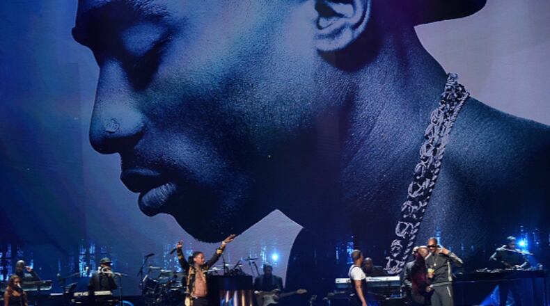 Treach, YG , T.I. and Snoop Dogg perform in honor of 2017 Rock & Roll Hall of Fame inductee Tupac Shakur, pictured  on a big screen onstage, at the 32nd annual induction ceremony at the Barclays Center on April 7, 2017 in New York City.