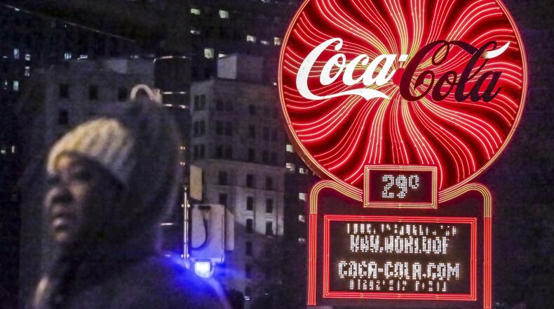 Coca-Cola said Tuesday it will begin cutting 1,200 jobs in the second half of this year. JOHN SPINK /JSPINK@AJC.COM