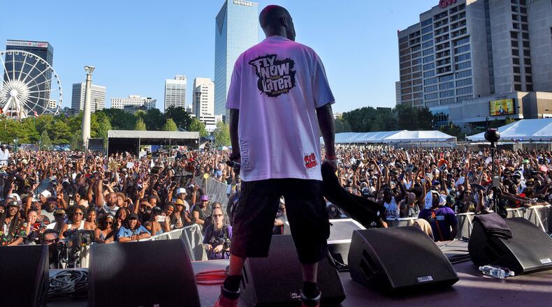 Rapper DMX took a break during his set to look at the thousands in attendance at One Musicfest, which is celebrating its 10th anniversary at Centennial Park. RYON HORNE/RHORNE@AJC.COM