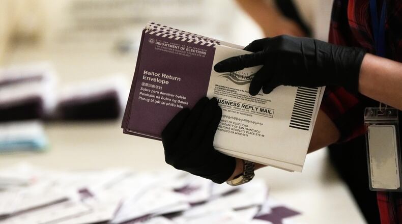 FILE - Department of Elections workers sort mail-in ballots for the California primary election at City Hall on Tuesday, June 2, 2026, in San Francisco. (AP Photo/Jeff Chiu, File)