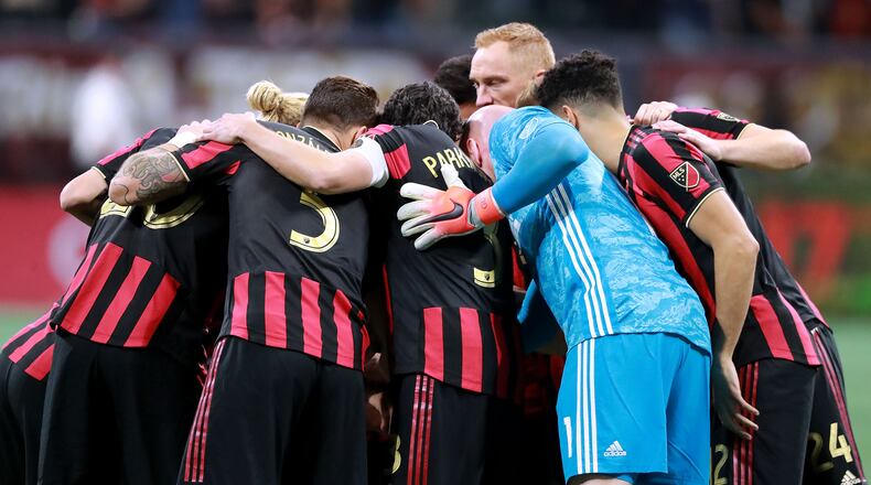 Atlanta United players huddle up as they prepare to play FC Cincinnati Sunday, March 10, 2019, at Mercedes-Benz Stadium in Atlanta.