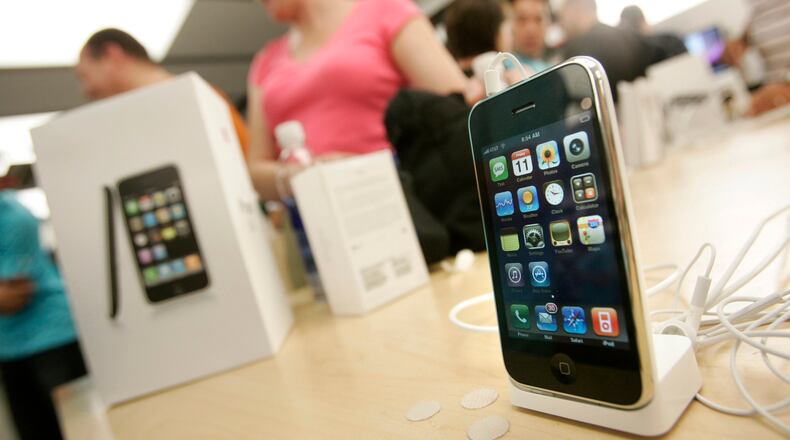 The new 3G iPhone is displayed on a table as customers buy the latest iPhone inside the Apple Store at Westfield Valley Fair in San Jose, Calif., on July 11, 2008. (Dai Sugano/Bay Area News Group/TNS)