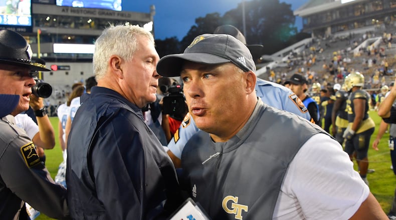 Georgia Tech coach Geoff Collins, right, and North Carolina coach Mack Brown meet up after a game against North Carolina, Saturday, Oct. 5, 2019, in Atlanta. North Carolina won 38-22. (John Amis/Special to the AJC)