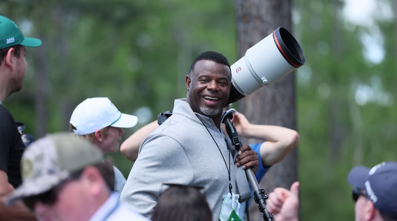 Hall of Fame baseball player Ken Griffey Jr. chats with patrons as he works as a photographer during first round of the Masters golf tournament, at Augusta National Golf Club, Thursday, April 10, 2025, in Augusta, Ga. (Jason Getz / AJC)