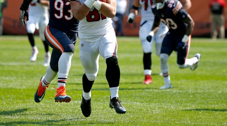 Atlanta Falcons tight end Austin Hooper (81) runs past Chicago Bears linebacker Sam Acho (93) after making a pass reception during the second half of an NFL football game, Sunday, Sept. 10, 2017, in Chicago. (AP Photo/Nam Y. Huh)