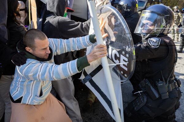 Protesters clash in November with police in Atlanta during a demonstration opposing construction of a public training safety center for the city. (Arvin Temkar / arvin.temkar@ajc.com)