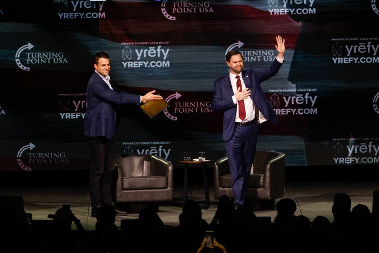 Vice President JD Vance, alongside Turning Point USA spokesperson Andrew Kolvet (left), waves following a Turning Point USA event at Akins Ford Arena in Athens, Ga., on April 14, 2026. (Arvin Temkar/AJC)