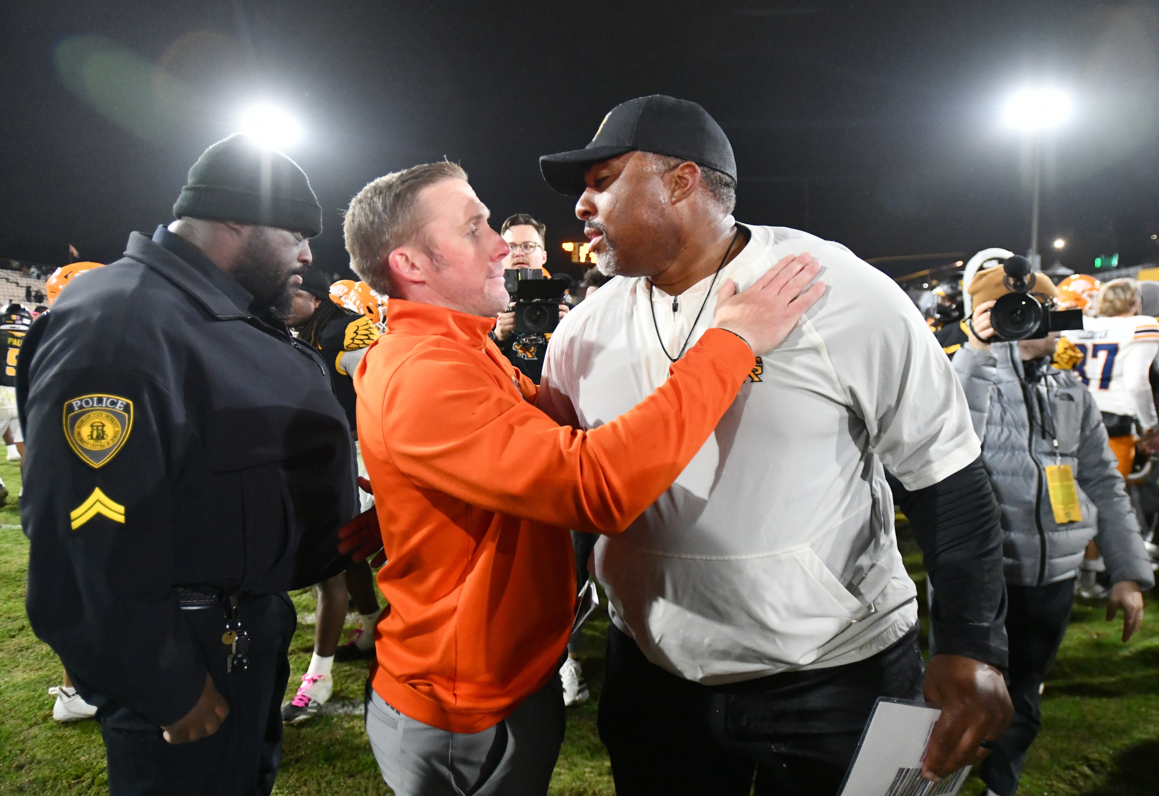 Kennesaw State head coach Jerry Mack and UTEP head coach Scotty Walden shake hands after Kennesaw State beat UTEP during an NCAA college football game at Fifth Third Stadium, Tuesday, October 28, 2025 in Kennesaw. Kennesaw State won 33-20 over University of Texas at El Paso. (Hyosub Shin / AJC)