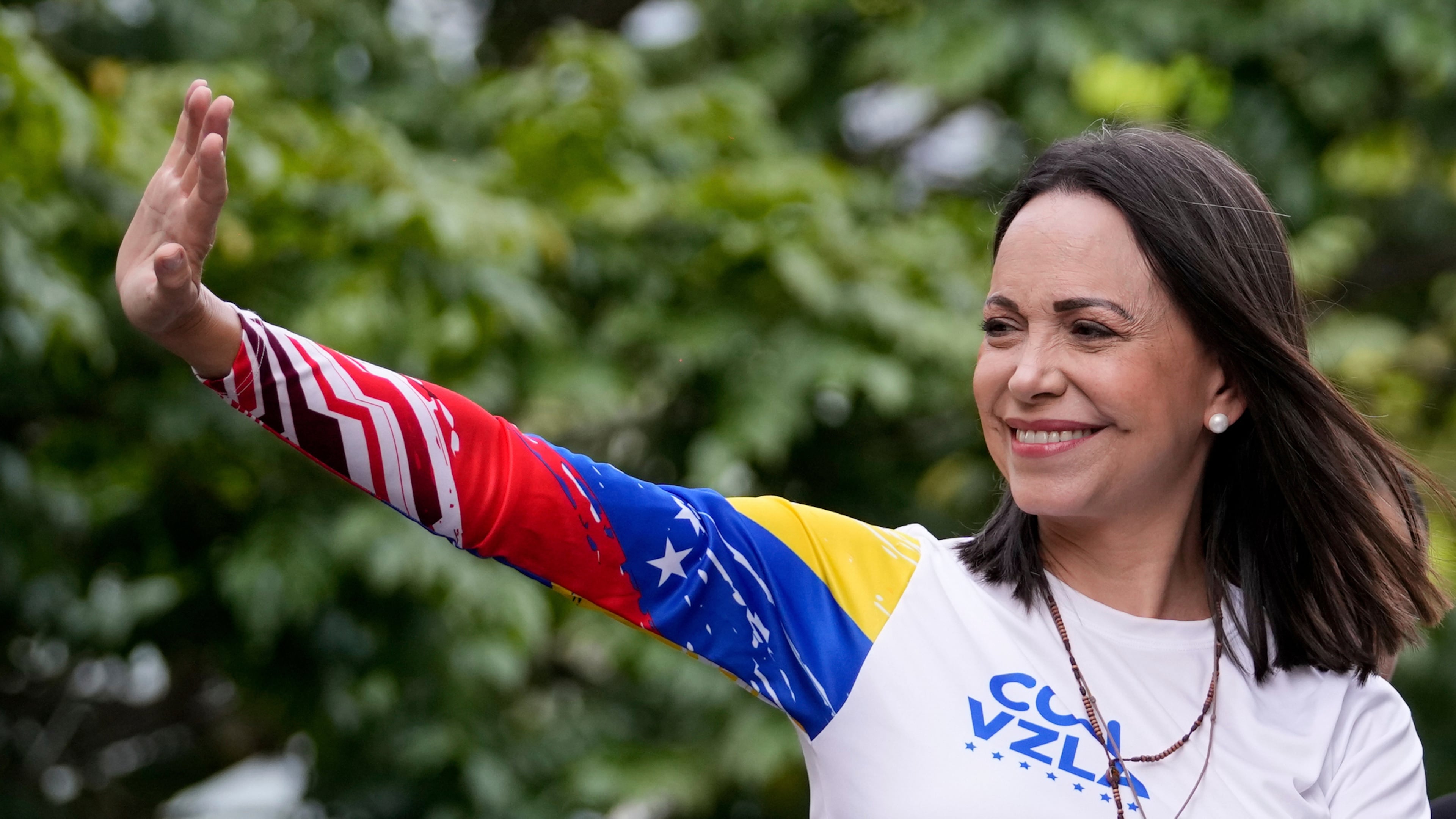 Opposition leader María Corina Machado waves from atop a truck during the closing election campaign rally for presidential candidate Edmundo Gonzalez in Caracas, Venezuela on July 25, 2024. (Matias Delacroix/AP file)