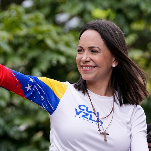 Opposition leader María Corina Machado waves from atop a truck during the closing election campaign rally for presidential candidate Edmundo Gonzalez in Caracas, Venezuela on July 25, 2024. (Matias Delacroix/AP file)