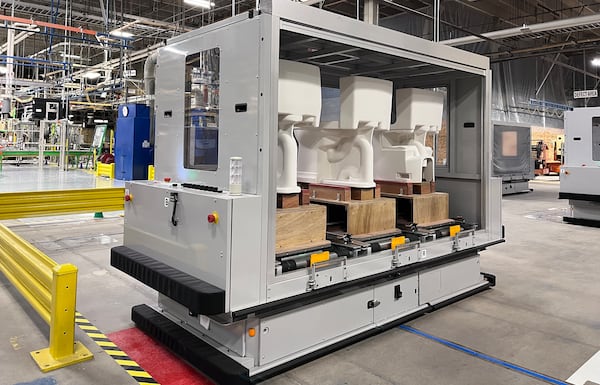 An Automated Guided Vehicle, or AGV, transports three toilets at a time between molding, drying, glazing and firing stations at Toto's factory in Morrow. (Courtesy of Toto USA)