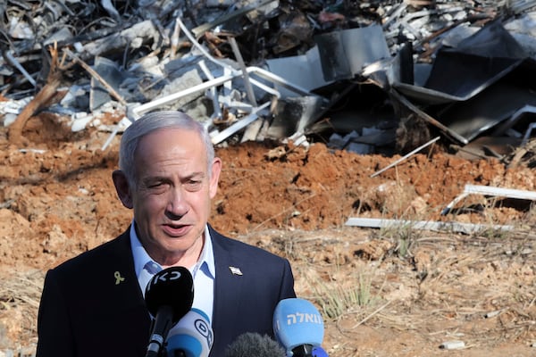 Israel's Prime Minister Benjamin Netanyahu gives a statement during a visit to the site of the Weizmann Institute of Science, which was hit by missiles fired from Iran, in the central city of Rehovot on Friday, June 20, 2025. (Jack Guez/Pool Photo via AP)