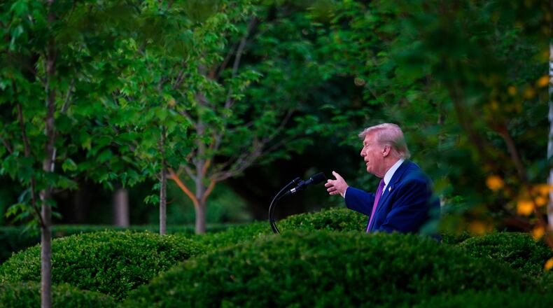 President Donald Trump speaks at a dinner for members of his administration and law enforcement organization leaders, during National Police Week, in the White House Rose Garden, Monday, May 11, 2026, in Washington. (AP Photo/Julia Demaree Nikhinson)
