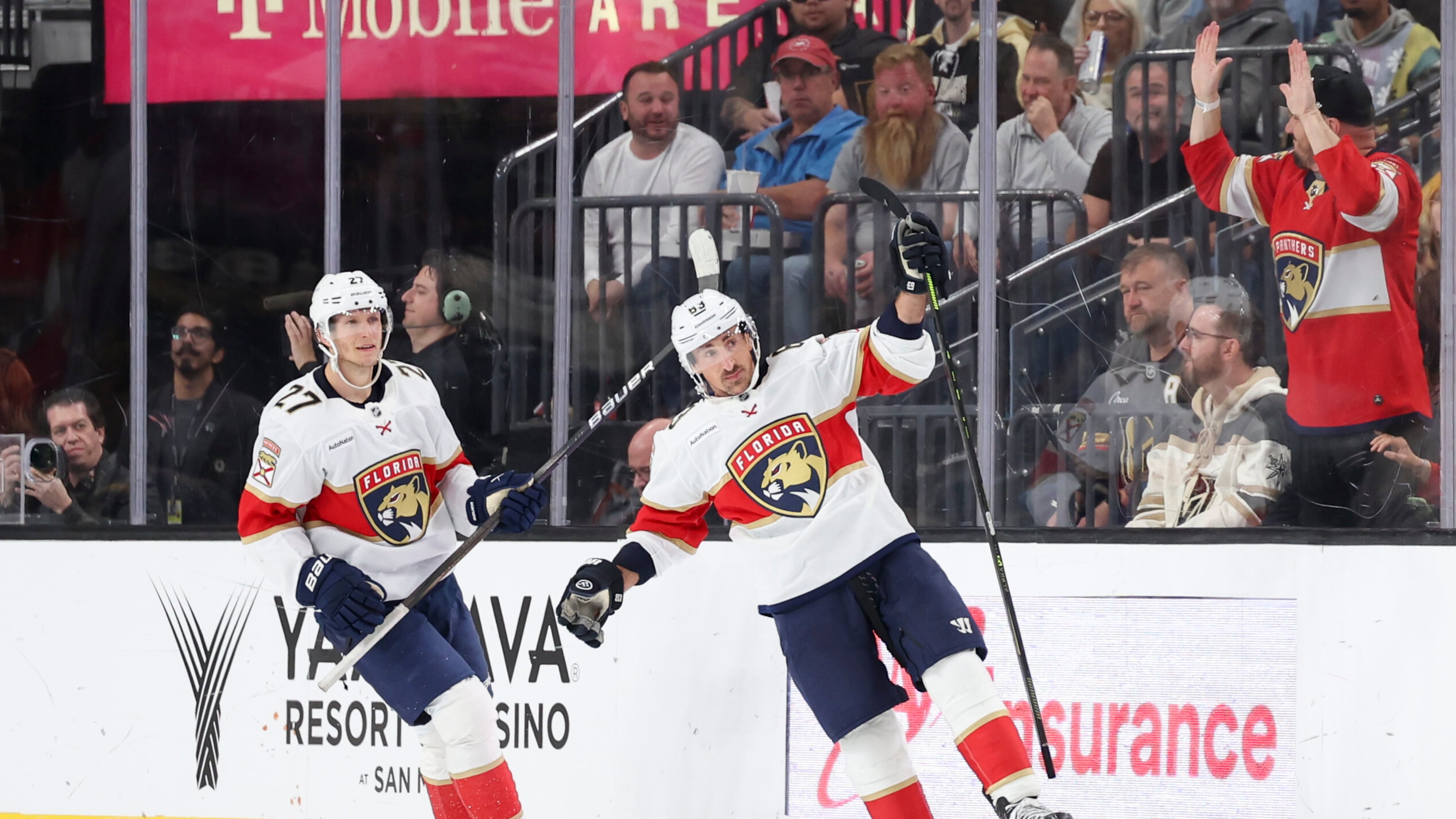 Florida Panthers center Eetu Luostarinen (27) and left wing Brad Marchand (63) celebrate after Marchand's goal against the Vegas Golden Knights during the second period of an NHL hockey game Monday, Nov. 10, 2025, in Las Vegas. (AP Photo/Ian Maule)