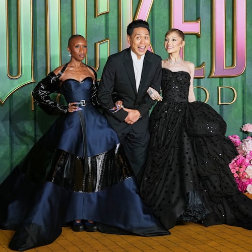 Cynthia Erivo, from left, director Jon M. Chu and Ariana Grande pose for photographers upon arrival at the premiere of the film "Wicked For Good" in London, Monday, Nov. 10, 2025. (Photo by Scott A Garfitt/Invision/AP)