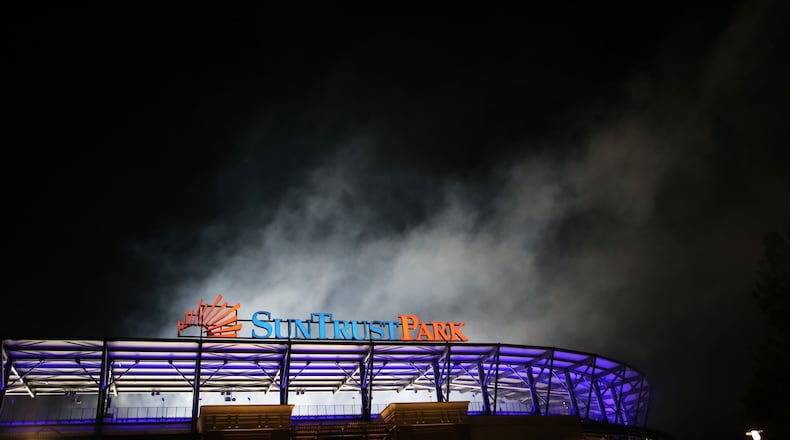 April 14, 2017, Atlanta, Georgia - The fireworks leave a cloud of smoke hovering above the stadium after the Atlanta Braves Opening Game at Suntrust Parkin Cobb County, Georgia, on April 14, 2017. (HENRY TAYLOR / HENRY.TAYLOR@AJC.COM)