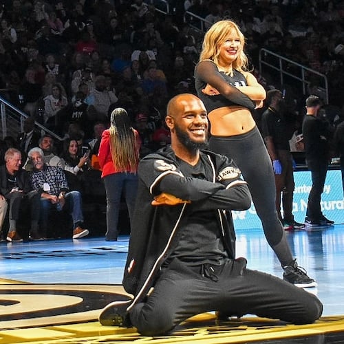Calvin Brown (center) and fellow ATL Dancers perform at an Atlanta Hawks game. He's been with the dance team since 2021, and is preparing to pursue other career goals. (Courtesy of Atlanta Hawks)