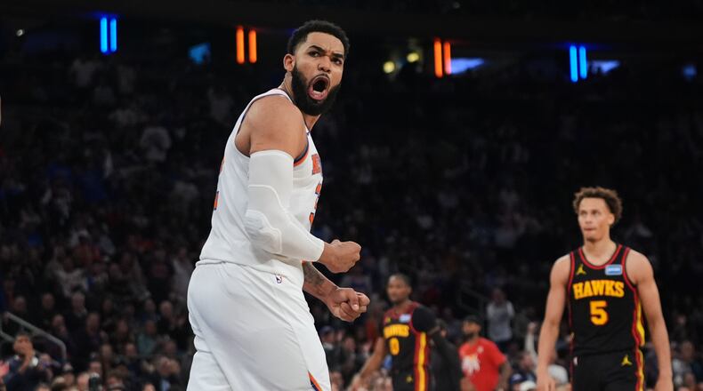 New York Knicks' Karl-Anthony Towns celebrates during the second half in Game 1 of a first-round NBA playoffs basketball series against the Atlanta Hawks, Saturday, April 18, 2026, in New York. (AP Photo/Frank Franklin II)