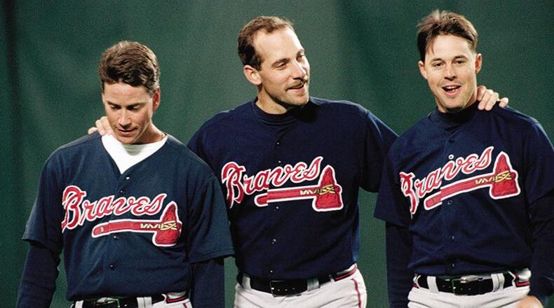 Tom Glavine (left) and Greg Maddux (right) were among the core of Atlanta's championship pitching staff that also included John Smoltz (center).