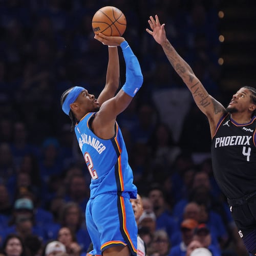 Oklahoma City Thunder guard Shai Gilgeous-Alexander (2) looks to shoot over Phoenix Suns guard Jalen Green (4) during the first half in Game 1 of a first-round NBA playoffs basketball series Sunday, April 19, 2026, in Oklahoma City. (AP Photo/Nate Billings)
