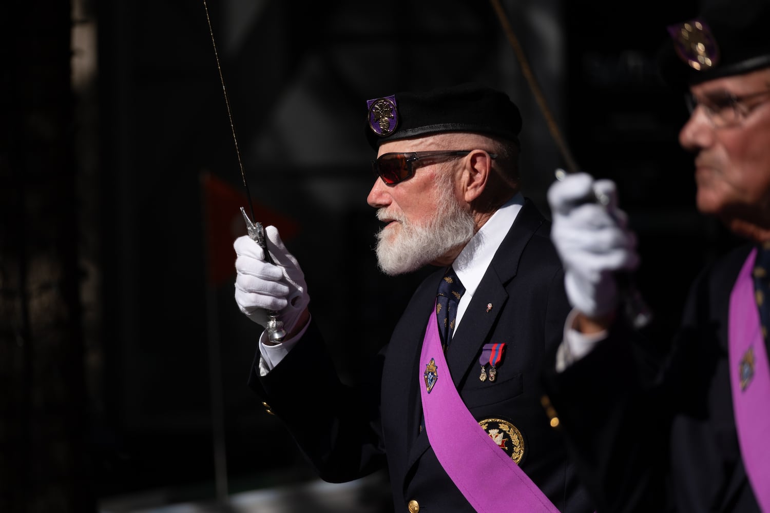 Patrick Waldron, with the Knights Of Columbus, marches during the Georgia Veterans Day Parade in Midtown Atlanta on Saturday, Nov. 8, 2025.   Ben Gray for the Atlanta Journal-Constitution
