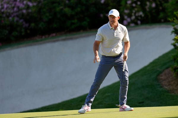 Rory McIlroy, of Northern Ireland, waves after making a putt on the 13th hole during the third round at the Masters golf tournament, Saturday, April 12, 2025, in Augusta, Ga. (AP Photo/David J. Phillip)