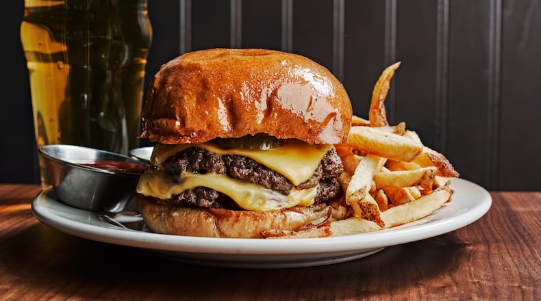 The burger remains a major draw at Holeman and Finch. Courtesy of Andrew Thomas Lee