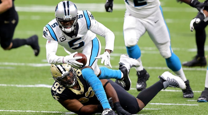 Carolina Panthers quarterback Teddy Bridgewater (5) runs with the ball while being tackled by the New Orleans Saints' David Onyemata (93) in the first quarter at the Mercedes-Benz Superdome in New Orleans on Sunday, Oct. 25, 2020. (Jonathan Bachman/Getty Images/TNS)