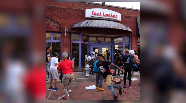 Looters steal from a Foot Locker Store  in downtown Atlanta as protests continued for a fourth day.  Protests over the death of George Floyd in Minneapolis police custody continued around the United States, as his case renewed anger about others involving African Americans, police and race relations.