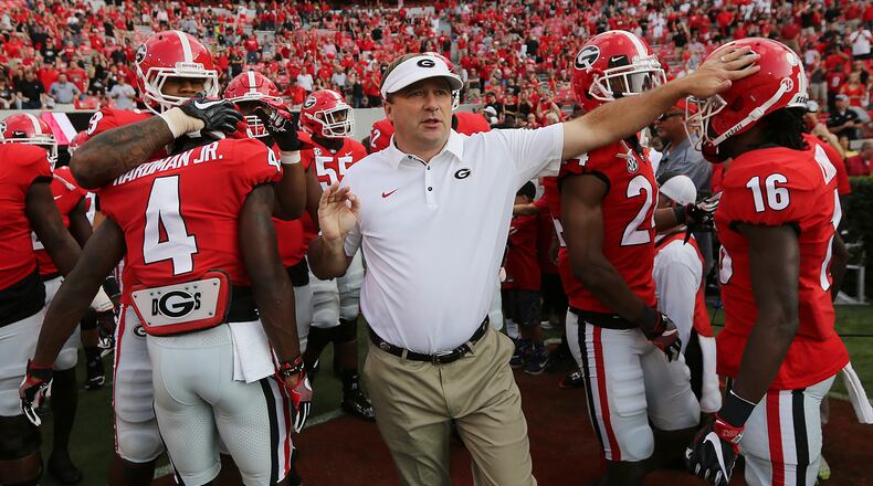 Georgia coach Kirby Smart and the team take the field to play Mississippi State during an NCAA college football game Saturday, Sept. 23, 2017, in Athens, Ga. (Curtis Compton/Atlanta Journal Constitution via AP)