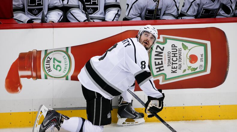 Los Angeles Kings' Drew Doughty (8) waits during a timeout during during an NHL hockey game against the Pittsburgh Penguins in Pittsburgh Friday, Dec. 11, 2015.(AP Photo/Gene J. Puskar)