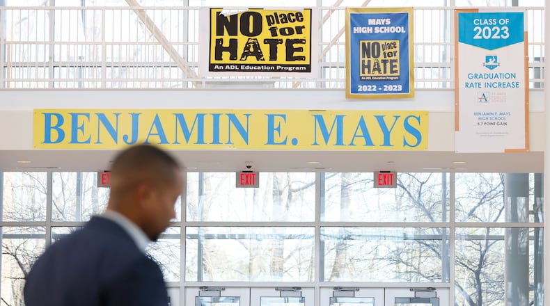 “No place for hate” signs are seen by the lobby of Benjamin E. Mays School. Four students suffered non-life-threatening injuries in a shooting in February, but the school received good news recently when popular restaurateur Pinky Cole Hayes announced she's helping to pay for the prom and Morris Brown College said it is offering admission to eligible students. (Miguel Martinez /miguel.martinezjimenez@ajc.com)