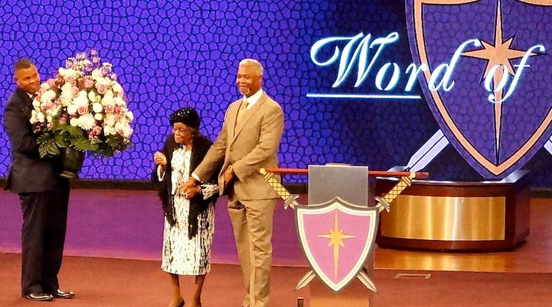 Rev. Emma Rowland with Bishop Dale Bronner when she was honored with 100 flowers at Word of Faith church in Austell where she preaches and teaches. Photo courtesy of Rowland's granddaughter Cheryl Pope Clark.