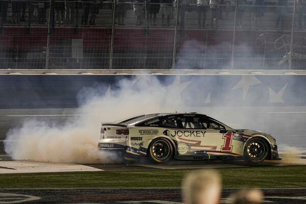 Ross Chastain does a burnout after winning a NASCAR Cup Series auto race at Charlotte Motor Speedway, Sunday, May 25, 2025, in Concord, N.C. (AP Photo/Matt Kelley)